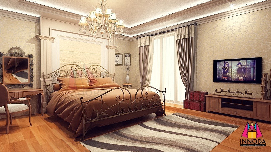 Classical canopy bedroom with wrought iron bed and crystal chandelier